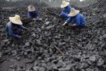 Chinese miners process coal from a mine